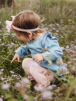 Baby Girls Light Wash Denim Long Sleeve Flutter Bubble Romper: Blue / 2T